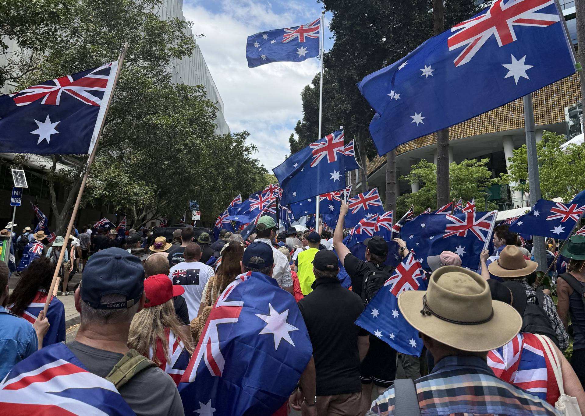 Rally crowd with Australian flags
